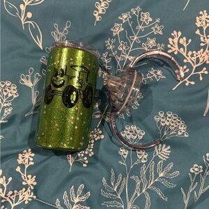 Tractor cup with Lincoln on it